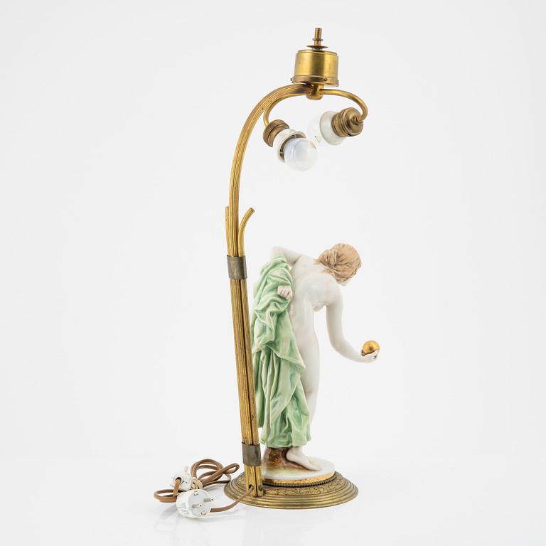 Walter Schott, an early 20th century porcelaine and brass table lamp.