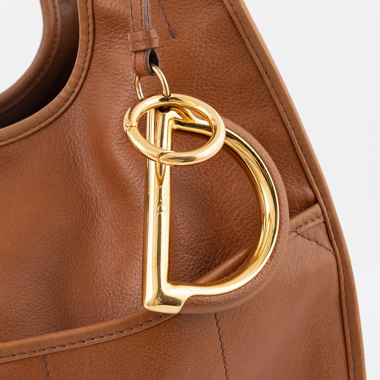 Christian Dior, a brown leather handbag.