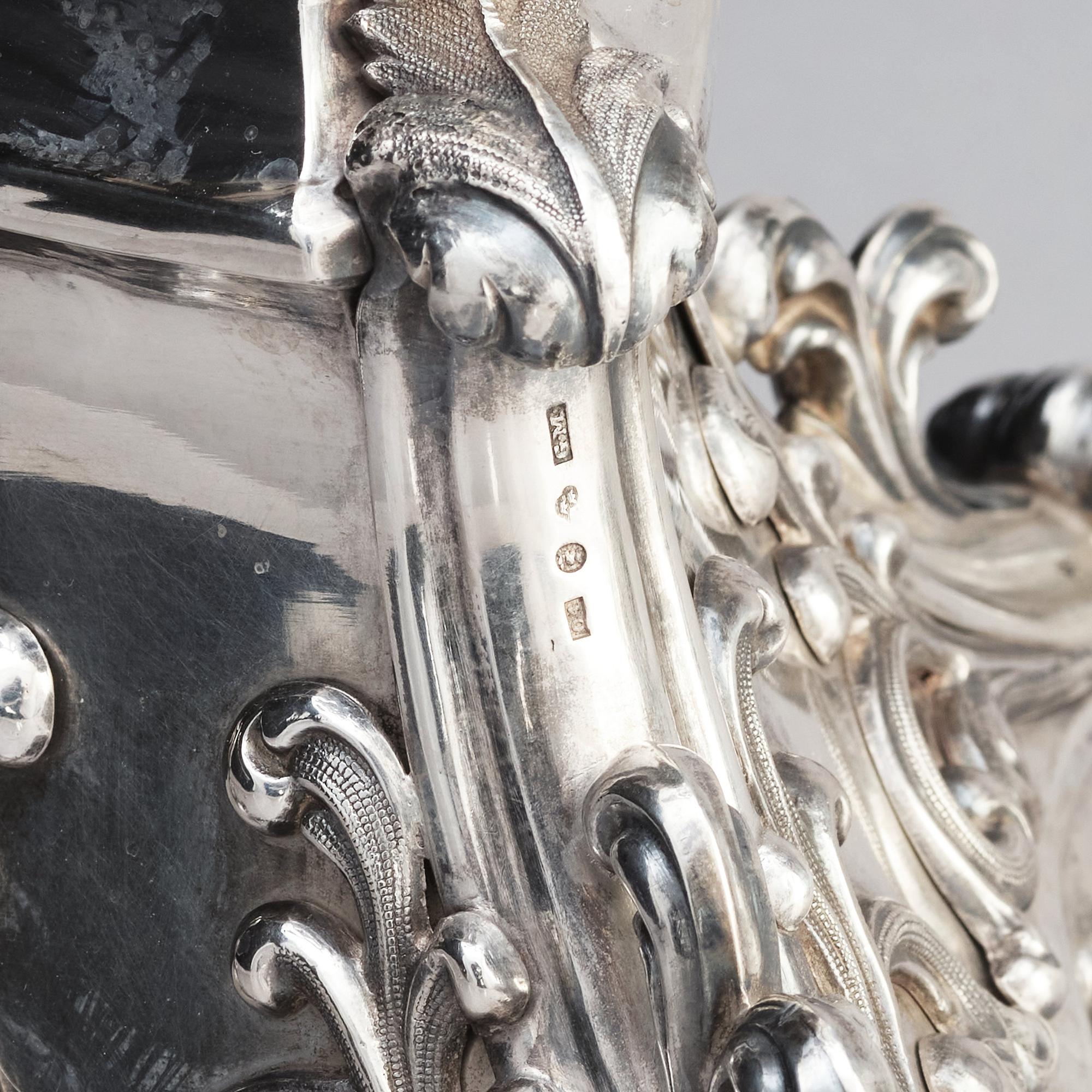 A pair of Swedish mid 19th century silver candelabra, marks of Gustaf Möllenborg, Stockholm 1844.
