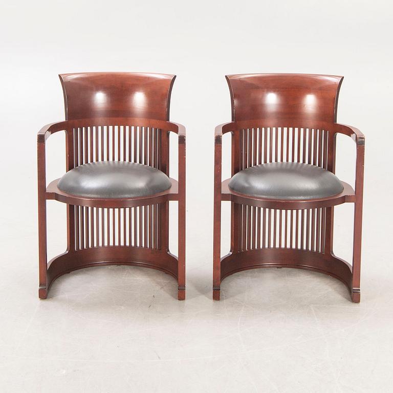 A pair of "606 Barrel Taliesin" armchairs by Frank Lloyd Wright for Cassina 1989, signed and numbered 28459, 28581.