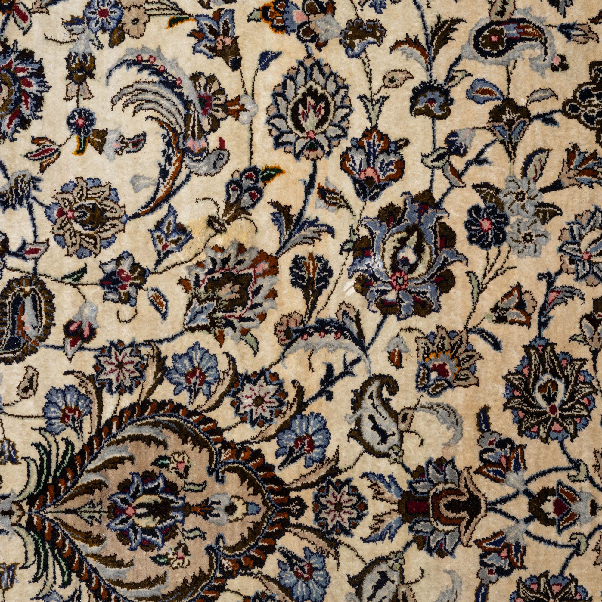 A semi-antique silk Keshan carpet, c. 350 x 248 cm.