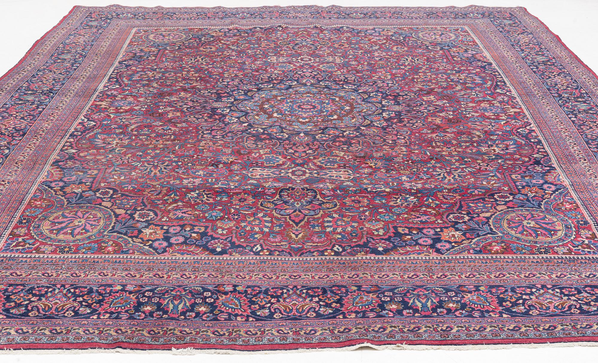 A Meshed carpet, c. 405 x 320 cm.