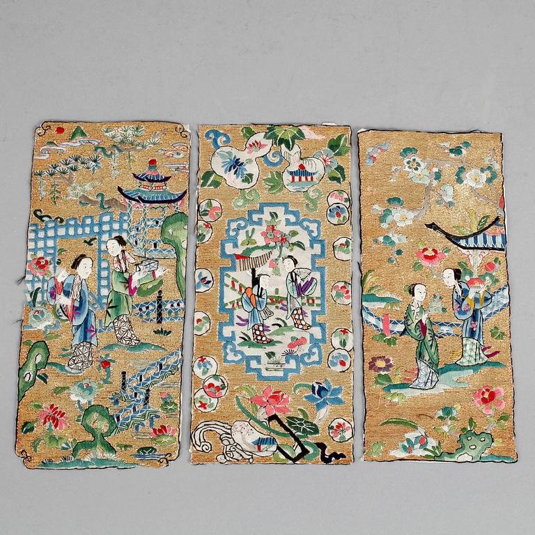 A set of three silk and gold-thread embroideries of court ladies in a garden, late Qing dynasty (1644-1912).
