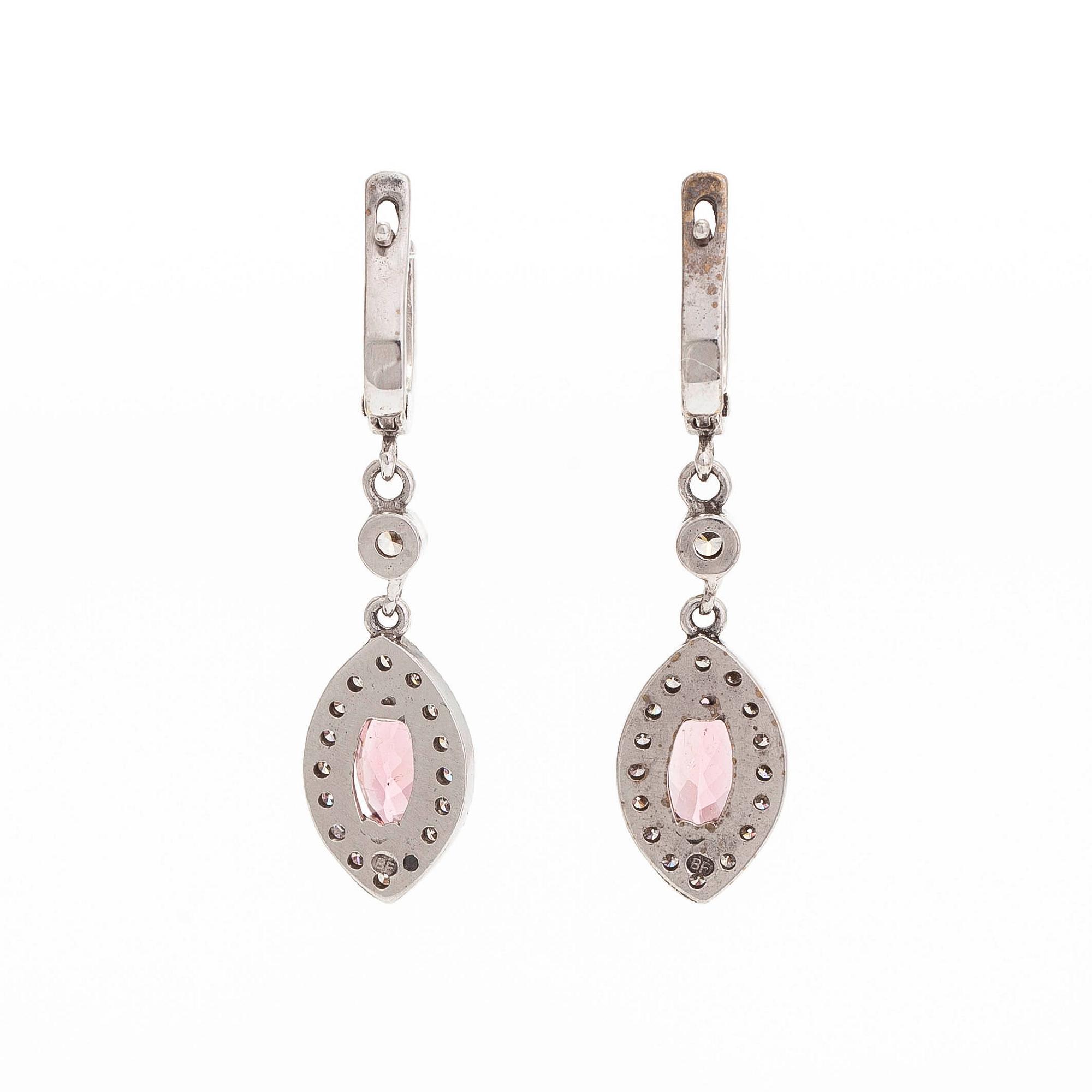 A pair of 14K white gold earrings, set with brilliant-cut diamonds and pink tourmalines.