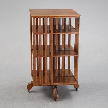 An oak revolving book case, early 20th Century.