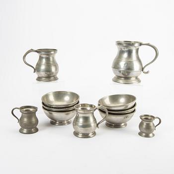 A set of five pewter tankards and six bowls England 20th century.