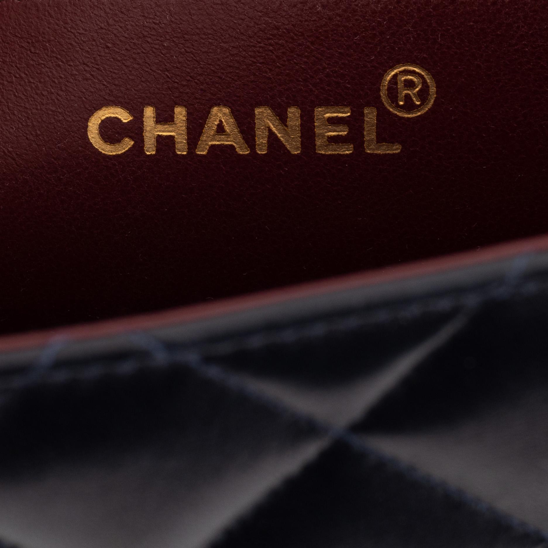 Chanel a black leather and gold hardware 'Maxi flapbag', 1991-1994.