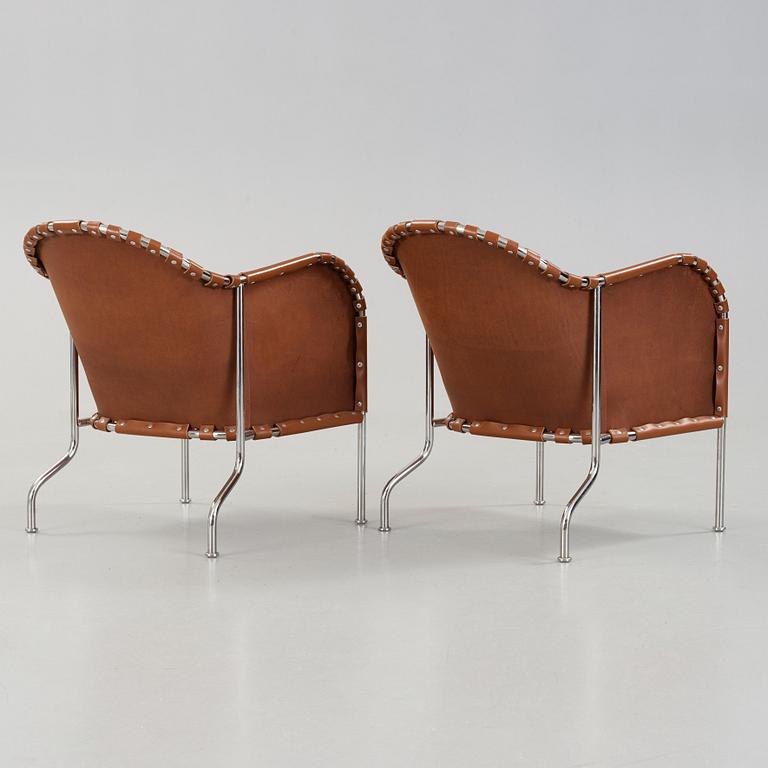 Mats Theselius, A pair of 'Bruno' brown leather and steel easy chairs, Källemo, Sweden.