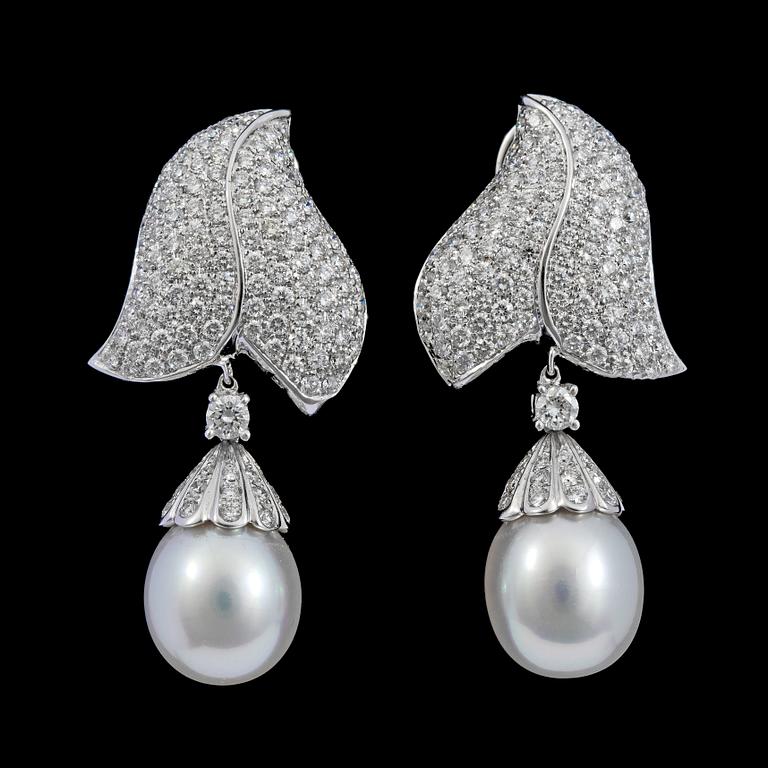 A pair of cultured pearl, 11,5 mm, and brilliant cut diamond earrings, tot. 3.20 cts.