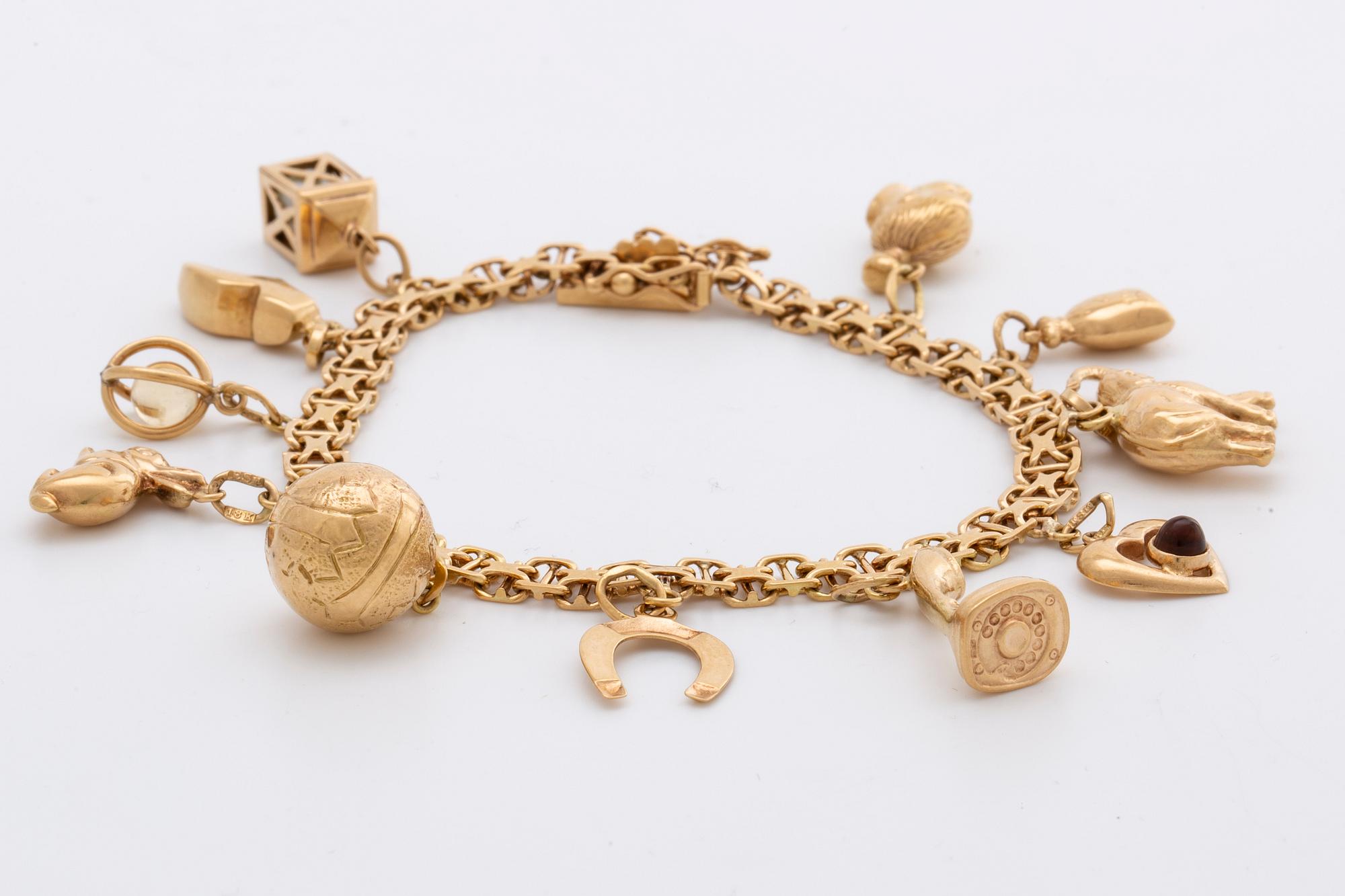 ARMBAND 18K guld berlocker 20,9 g, Stockholm 1958.
