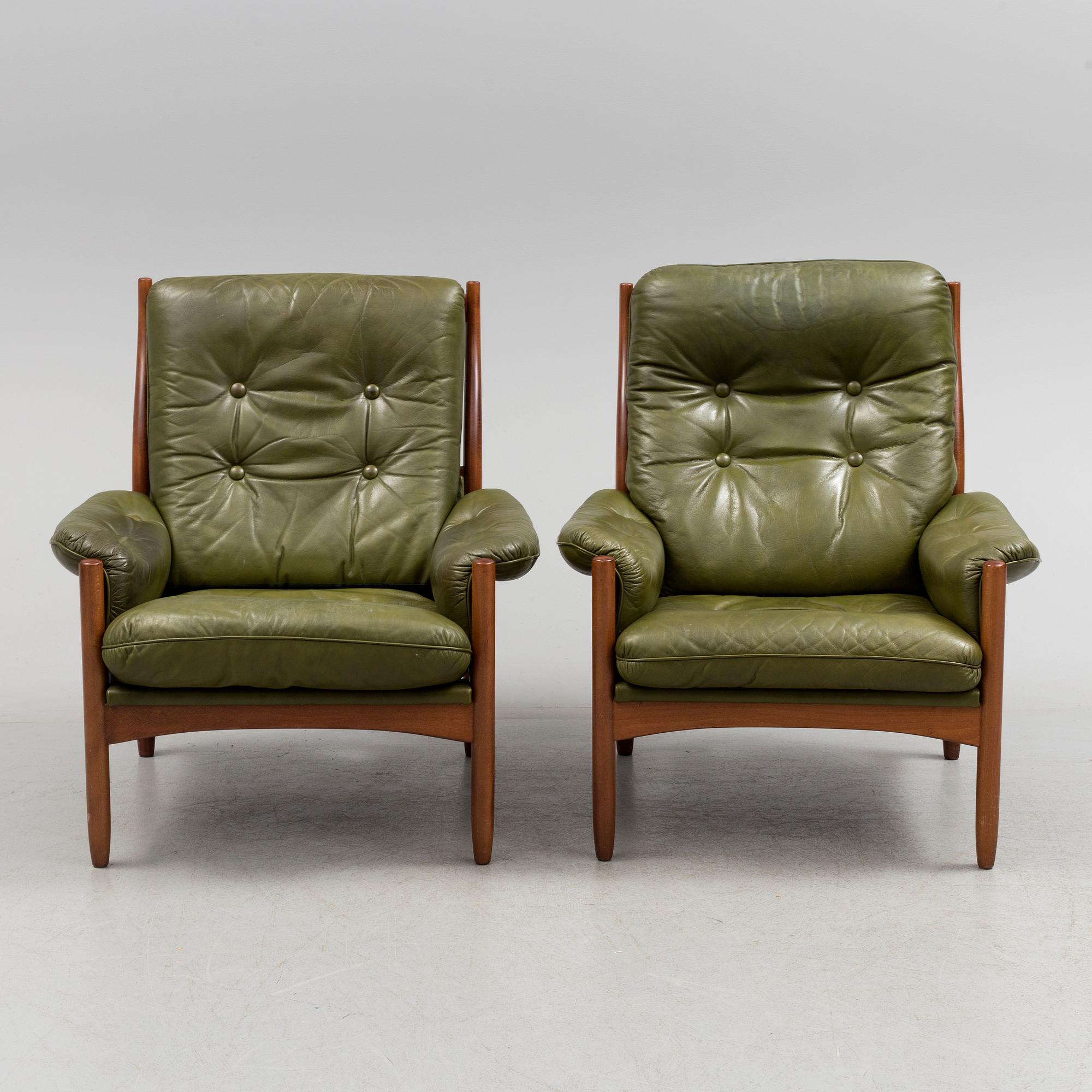 A pair of stained beech and leather easy chairs from Göte Möbler, Nässjö, second half of the 20th century.