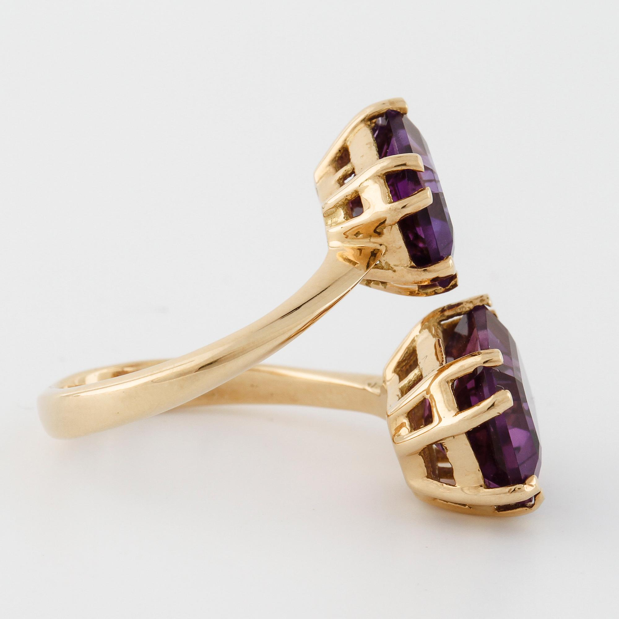 A emerald cut amethyst ring.