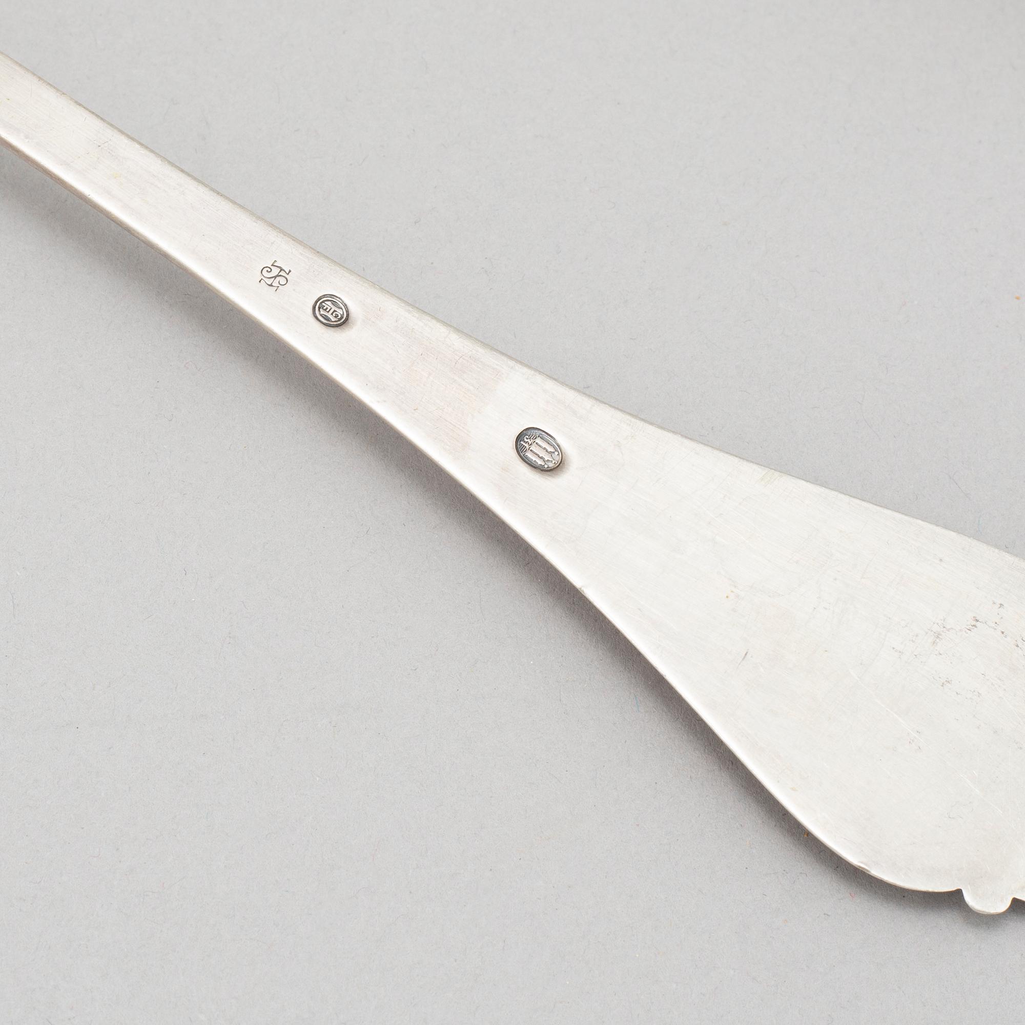 Johan Rohde, an 'Acorn' sterling sauce ladle, Georg Jensen post 1945 + a Danish silver serving spoon, Copenhagen 1931.