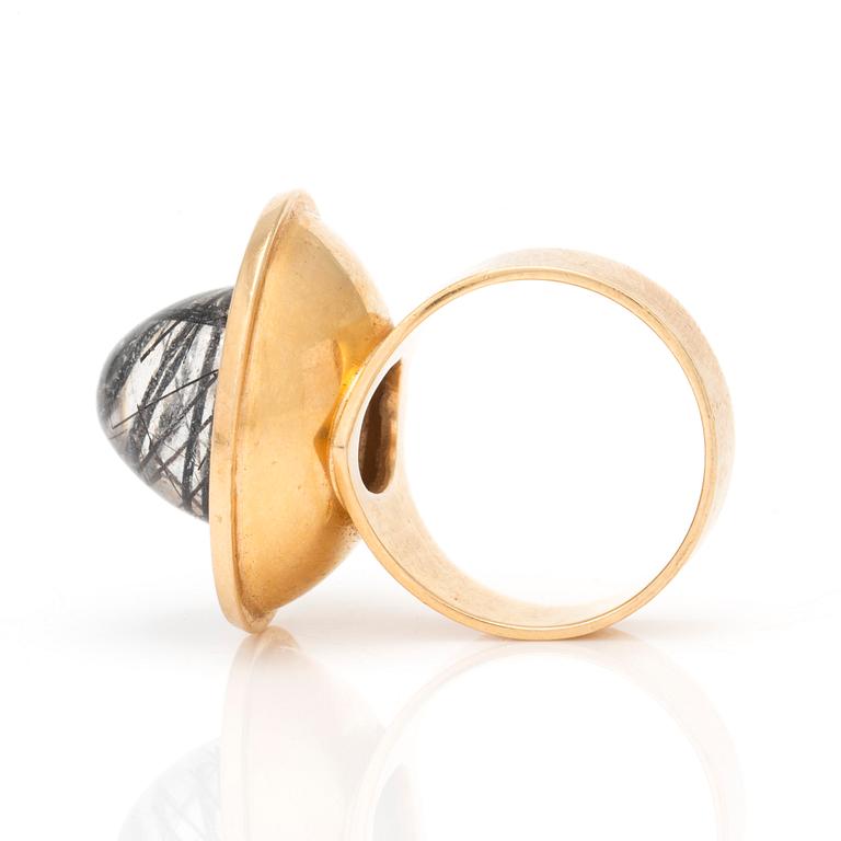 A ring with cabochon-cut rutilated quartz.