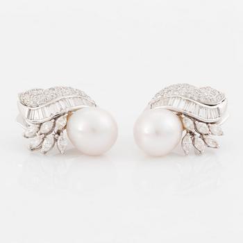 429. A pair of 18K white gold earrings set with cultured pearls and round brilliant-, navette- and baguette-cut diamonds.