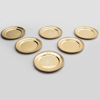 Twelve silver-gilt plates, mark of company C.G. Hallberg, Stockholm 1913-1917.