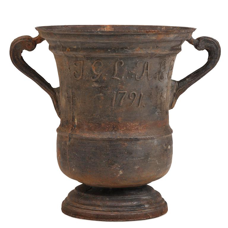 A cast-iron garden urn from Hellefors styckebruk, dated 1791.