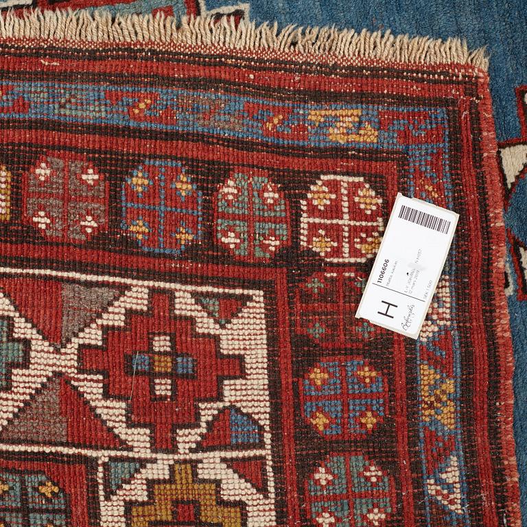 A RUNNER, a semi-antique Caucasian, ca 303,5 x 129,5-140,5 cm (as well as one end with 2,5 cm flat weave).