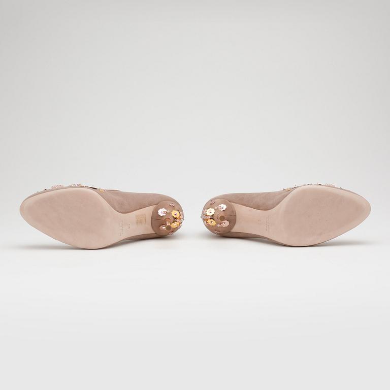 MIU MIU, a pair of beige suede pumps with sequined embellishment.
