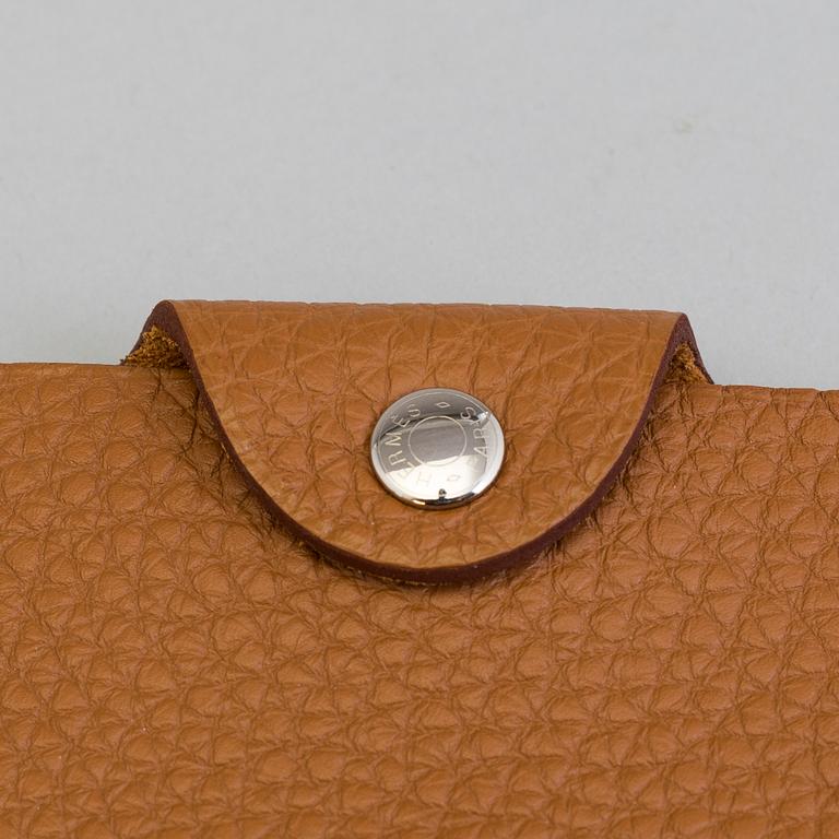 A leather Hermès notebook case.