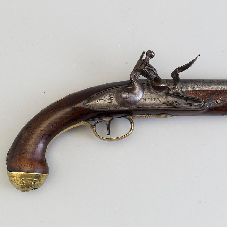 A early 19th century walnut flintlock pistol markt Turner.