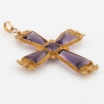 An 18K gold cross with amethysts with a 23K gold chain.