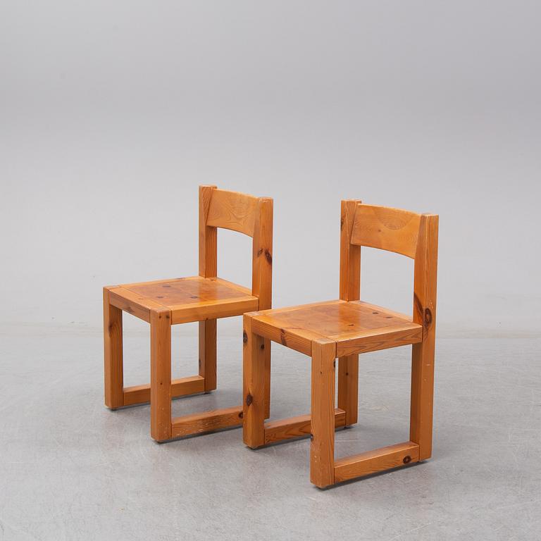 A set of six mid 20th century pine wood chairs with wheels.