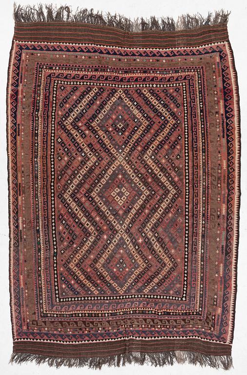 A semi-antique kilim carpet, a. 385 x 251 cm.