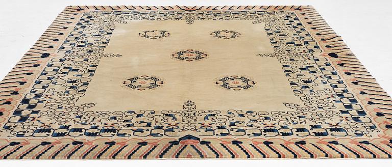 A semi.antique Chinese carpet, c 310 x 128 cm.