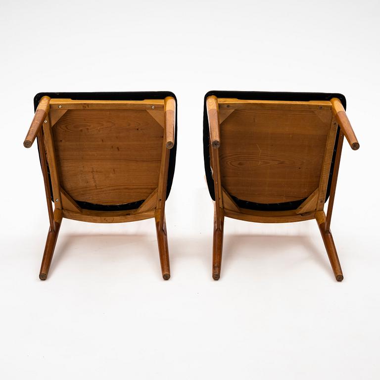 A pair of Scandinavian Mid Century Modern teak, oak and elm chairs.