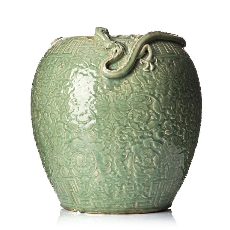 A large celadon 'lotus and qilong' vase, Qingdynasty, 19th century.