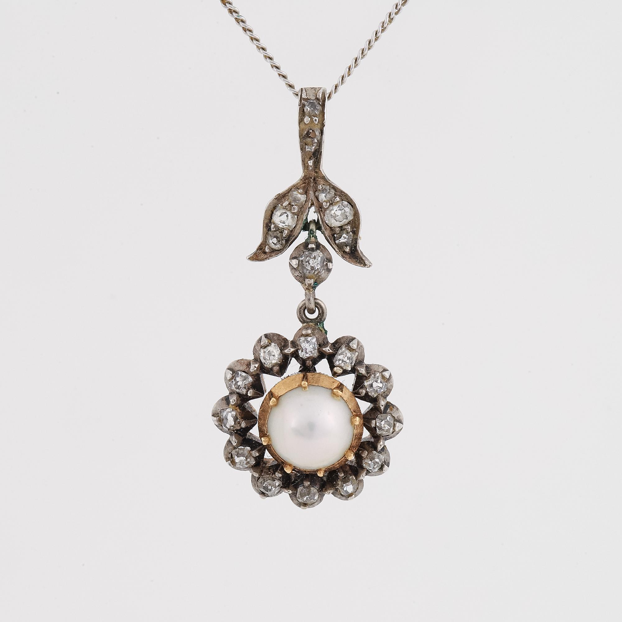Old-cut diamond and pearl pendant.
