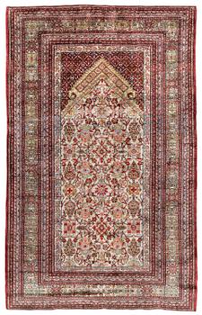 484A. A semi-antique silk Qum rug, central Persia 221 x 138 cm.