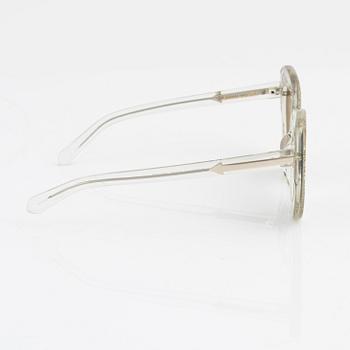 Karen Walker, a pair of "Intergalactic" sunglasses.