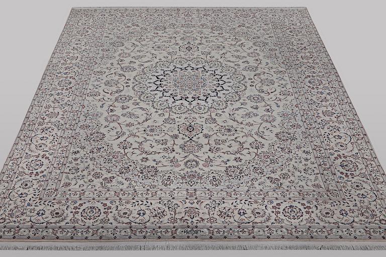 A carpet, Nain, part silk, ca 341 x 245 cm.