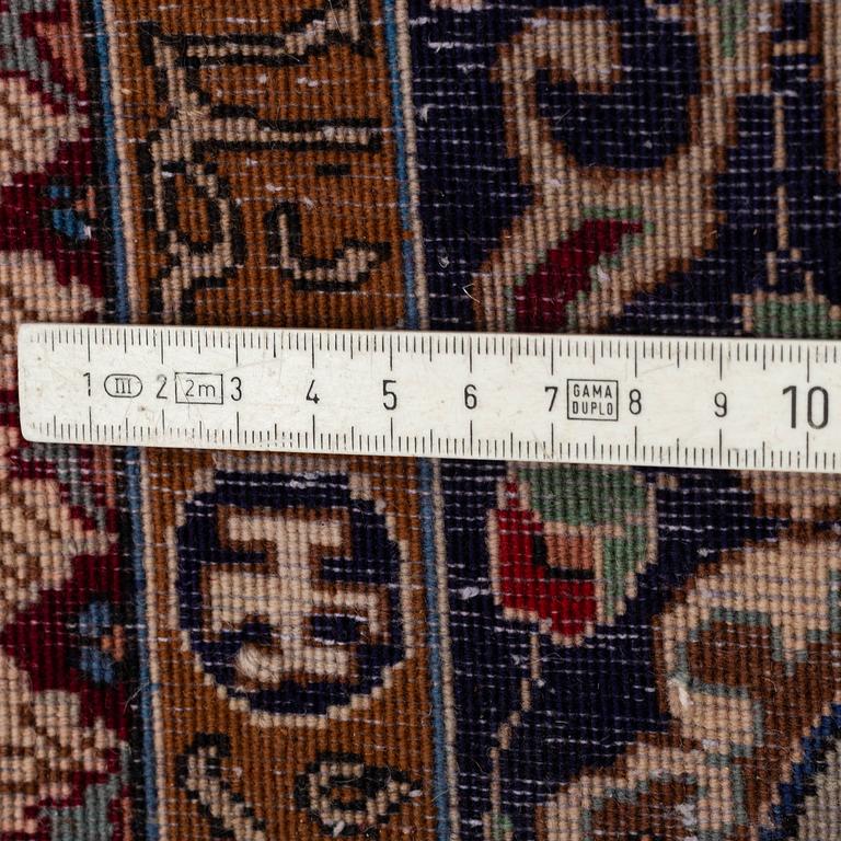 A RUG, probably Tabriz, figural, the "Four seasons", ca 233 x 159 cm (as well as 1,5 cm flat weave at the ends).