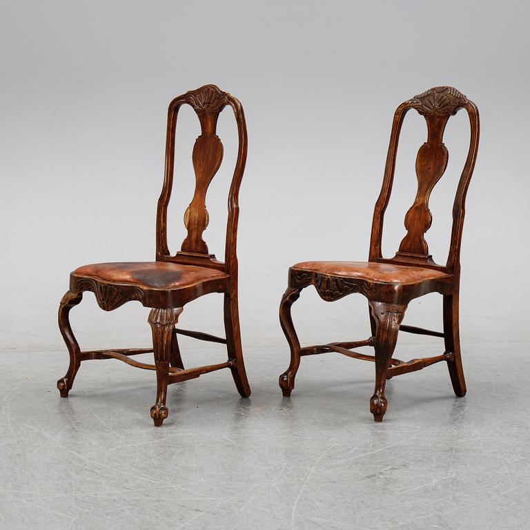 A set of nine English stained beech wood chairs, first half of the 18th Century.