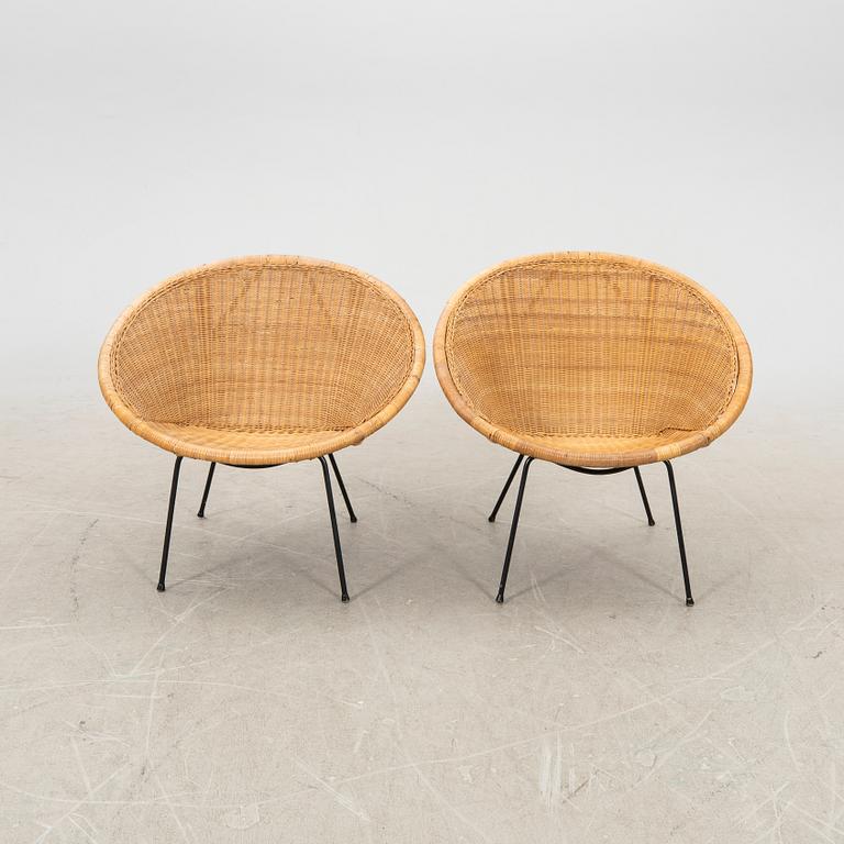 A pair of rattan 1950s easy chairs.