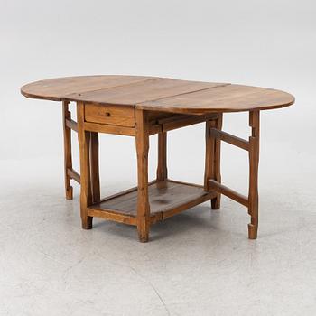 An 19th century drop-leaf table.