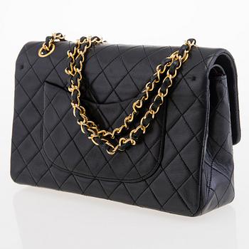 CHANEL Black Double Flap Bag.