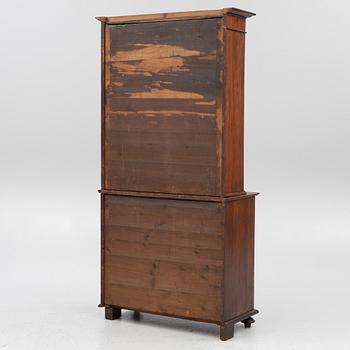 A two part mahogany cabinet, around 1900.