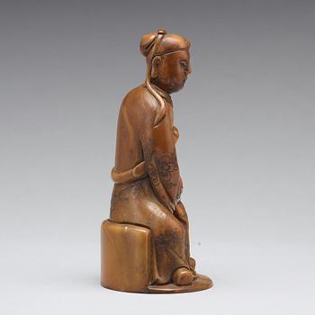 A soapstone sculpture of a mandarin official, late Qing dynasty.