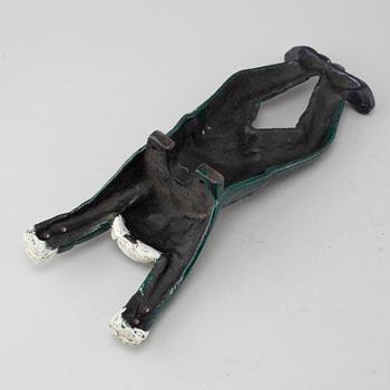 A 20th century cast iron boot jack.