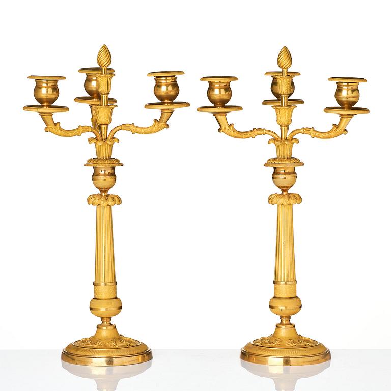 A pair of Empire ormolu three light Candelabra.
