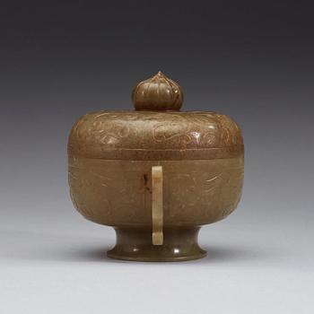 A carved archaistic nephrite bowl with cover decorated with taotie-masks, China, 20th Century.