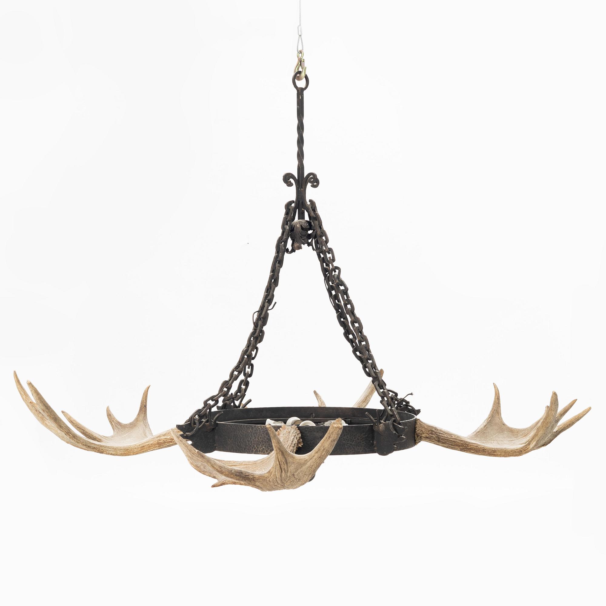 A moose horn and cast iron chandelier from around 1900.