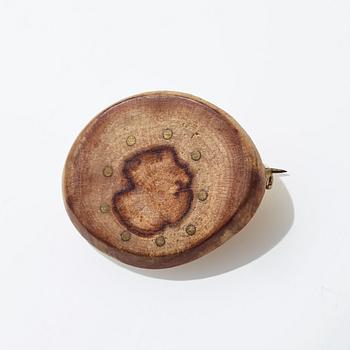 Vivianna Torun Bülow Hübe, a wood and brass brooch, executed in her own workshop in Stockholm ca 1952.