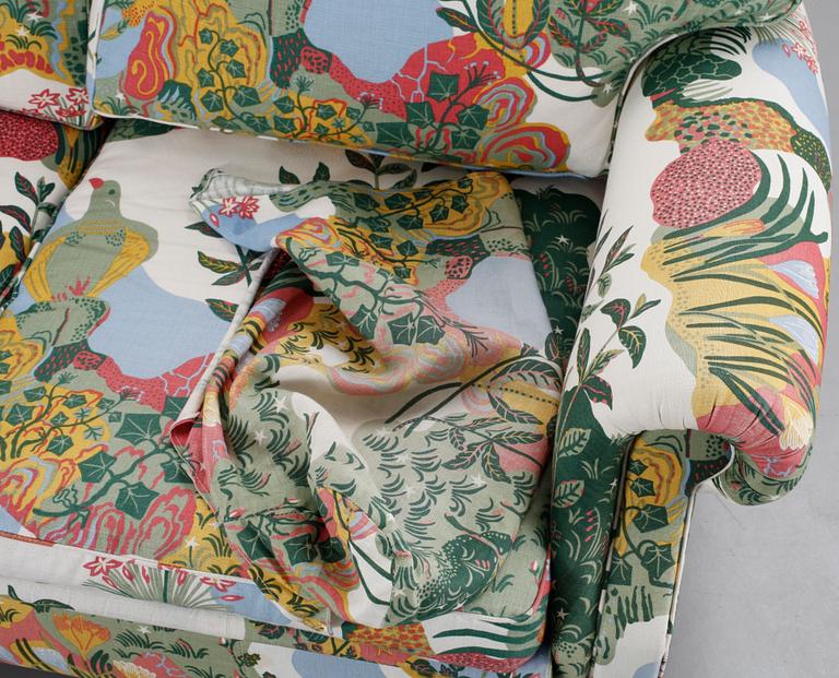An Arne Norell sofa upholstered in Josef Frank's fabric 'Anakreon'.