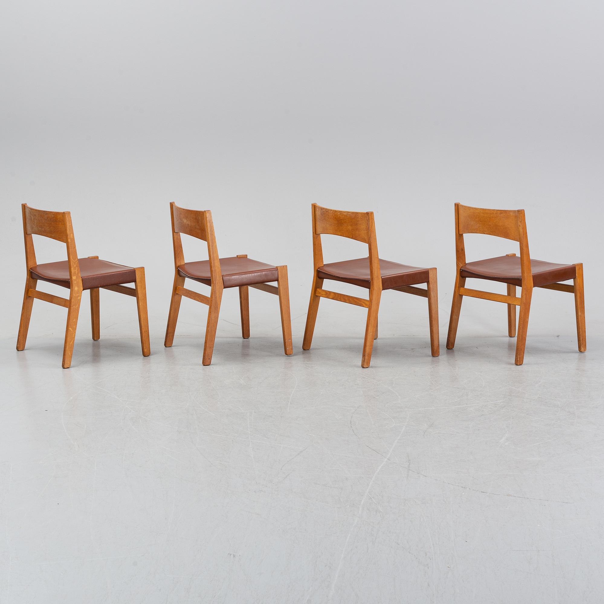 Four oak chairs with leather seat by John Vedel Rieper, Denmark, 1962.
