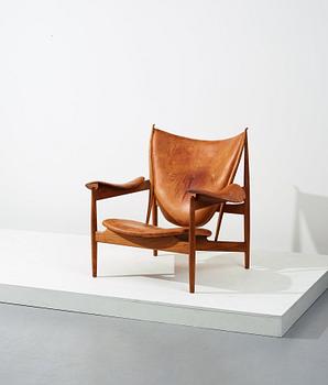 Finn Juhl, a teak and natural brown leather "Chieftain Chair" by Niels Vodder, 1950-60's.